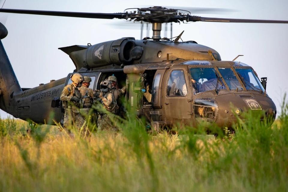 Paratroopers assigned to 2nd Battalion, 325th Airborne Infantry Regiment, 2nd Brigade Combat Team, 82nd Airborne Division load onto a UH-60 Black Hawk provided by paratroopers assigned to the 82nd Combat Aviation Brigade, 82nd Airborne Division during an Aug. 19, 2023, Culminating Training Exercise - Falcon Giant on Fort Liberty. The Combat Aviation Brigade will be deploying this fall.