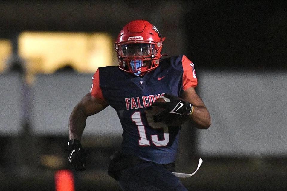 Jordan running back Amareon Blue (15) runs for yardage during the first half against Riverside.The Riverside Pirates and the Jordan Falcons met in a conference football game in Durham, N.C. on October 13, 2023.