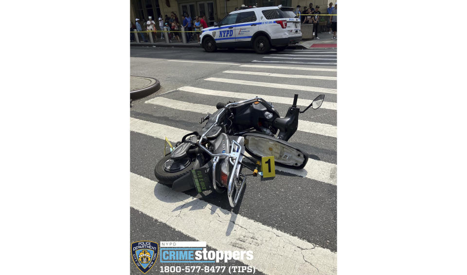 This photo provided by the New York City Police Department, Saturday, July 8, 2023, shows a motor scooter recovered at the scene of a shooting, in the Queens borough of New York. An 86-year-old New York City man was fatally shot and at least two others were seriously wounded by a man on a scooter who police say was shooting randomly at cars and pedestrians in Queens on Saturday. (New York City Police Department via AP)