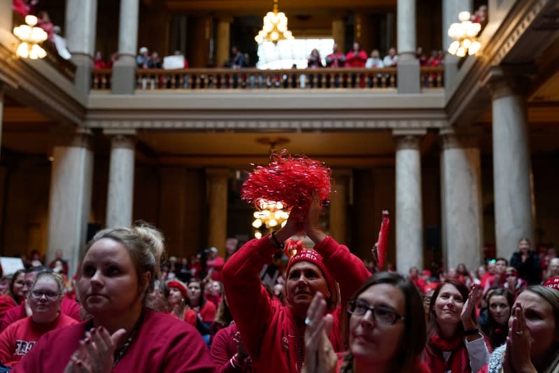 Educators and their supporters gather in the Capitol Building as teachers hold a one day walkout at the statehouse in Indianapolis