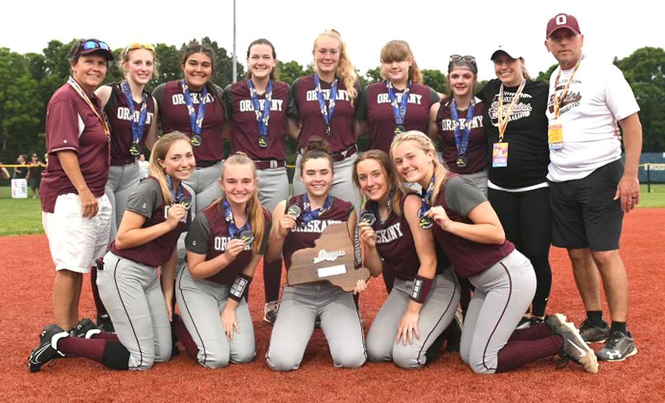 The Oriskany Redskins pose with medals and their plaque at the NYSPHSAA softball Final Four on Long Island.