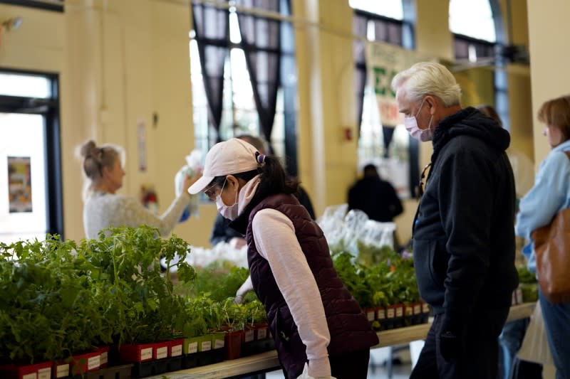 Shoppers examine fresh herbs at Farmers Public Market in Oklahoma City