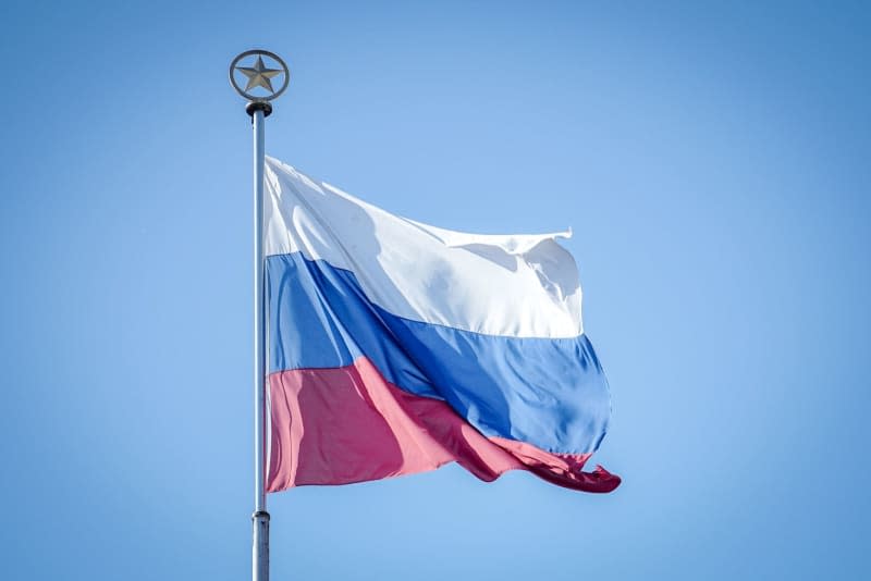 The Russian flag flies over the Russian embassy in Berlin.  Germany summoned the acting chargé d'affaires of the Russian embassy in response to a Russian cyber attack on the ruling Social Democratic Party (SPD) last year, a Foreign Office spokesman said.  Kay Nietfeld/dpa