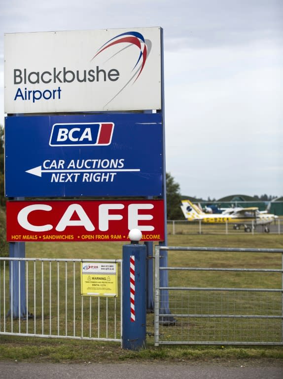 A sign at the entrance to Blackbushe Airport in Hampshire, southern England on August 1, 2015 where four people died when a Saudi Arabia-registered private jet crashed into a car auction lot