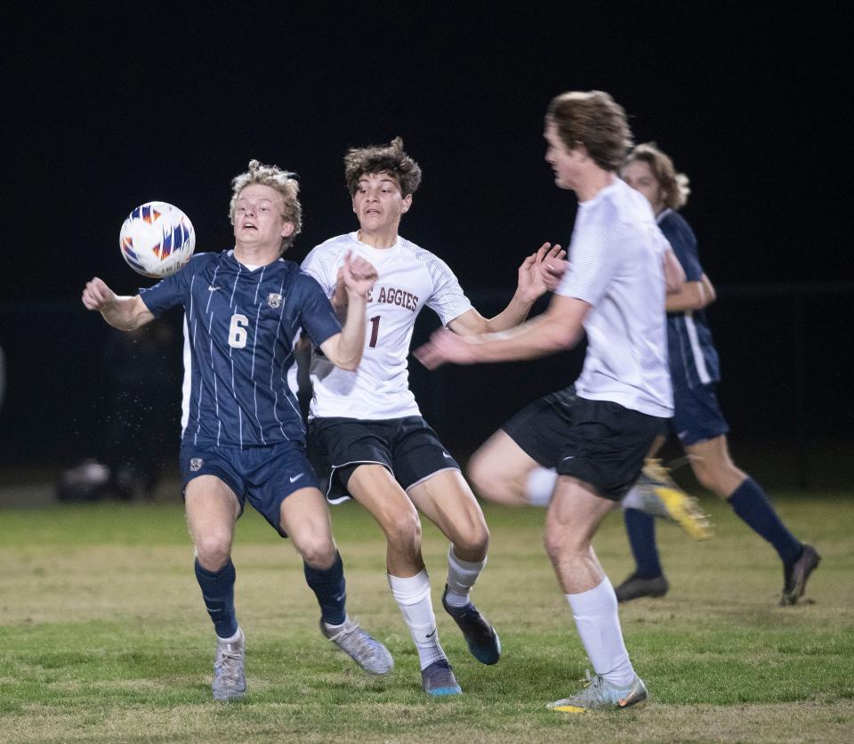 Gulf Breeze High's Colin Troxell (No. 9) settles the ball and wins possession over the Tate High defense during the District 1-6A Finals on Wednesday, Feb. 1, 2023. 