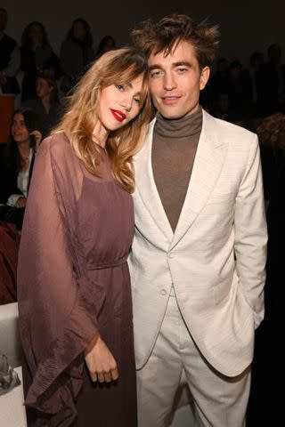 <p>Stephane Cardinale - Corbis/Corbis via Getty</p> Suki Waterhouse and Robert Pattinson attend the Dior Fall 2023 Menswear Show on December 3, 2022 in Giza, Egypt