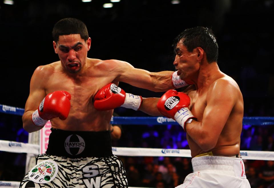 NEW YORK, NY - OCTOBER 20: Danny Garcia and Erik Morales exchange punches during their WBC/WBA junior welterweight title at the Barclays Center on October 20, 2012 in the Brooklyn Borough of New York City. (Photo by Al Bello/Getty Images for Golden Boy Promotions)