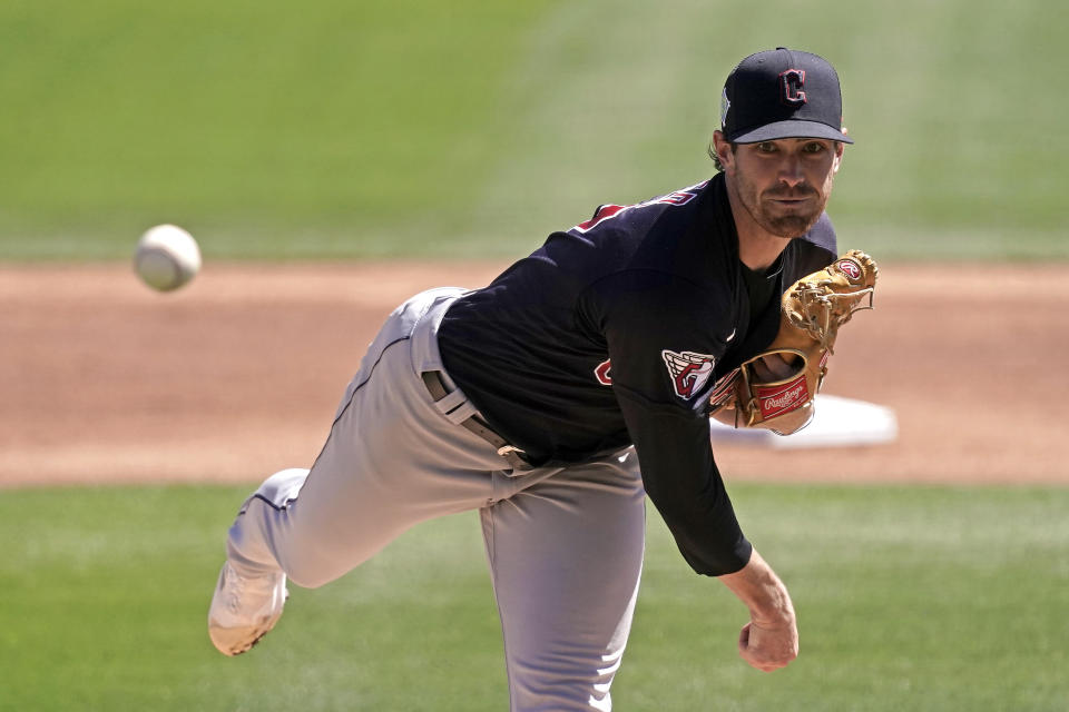 Cleveland Guardians starting pitcher Shane Bieber throws during the first inning of a spring training baseball game against the Los Angeles Dodgers Wednesday, March 23, 2022, in Glendale, Ariz. (AP Photo/Charlie Riedel)