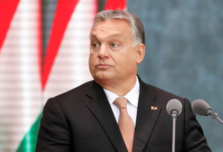 FILE PHOTO: Hungarian Prime Minister Viktor Orban delivers a speech in front of the House of Terror during the celebrations of the 62nd anniversary of the Hungarian Uprising of 1956, in Budapest, Hungary, October 23, 2018. REUTERS/Bernadett Szabo/File Photo