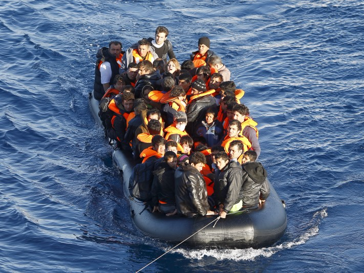 A dinghy full of refugees and migrants is towed by a Turkish Coast Guard fast rigid-hulled inflatable boat (not seen) on the Turkish territorial waters of the North Aegean Sea, following a failed attempt of crossing to the Greek island of Chios, off the shores of Izmir, Turkey, February 28,  2016. Picture taken February 28, 2016. REUTERS/Umit Bektas 