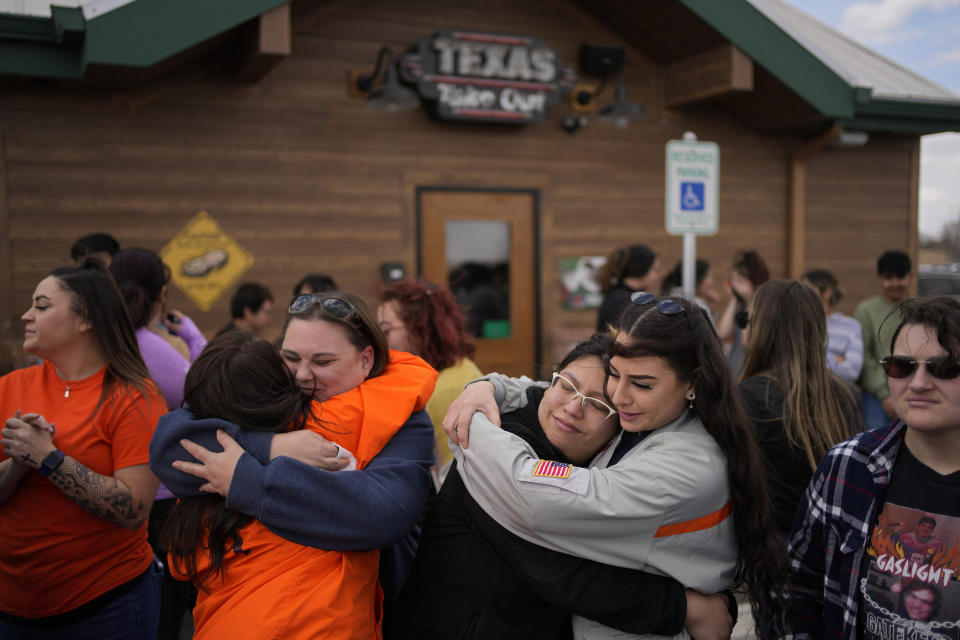 People attend a memorial for Jackson Zinn at a Texas Roadhouse restaurant, Thursday, March 17, 2022, in Hobbs, New Mexico. Zinn, who worked at the restaurant, was killed with several other student golfers and the coach of University of the Southwest in a crash in Texas. (AP Photo/John Locher)