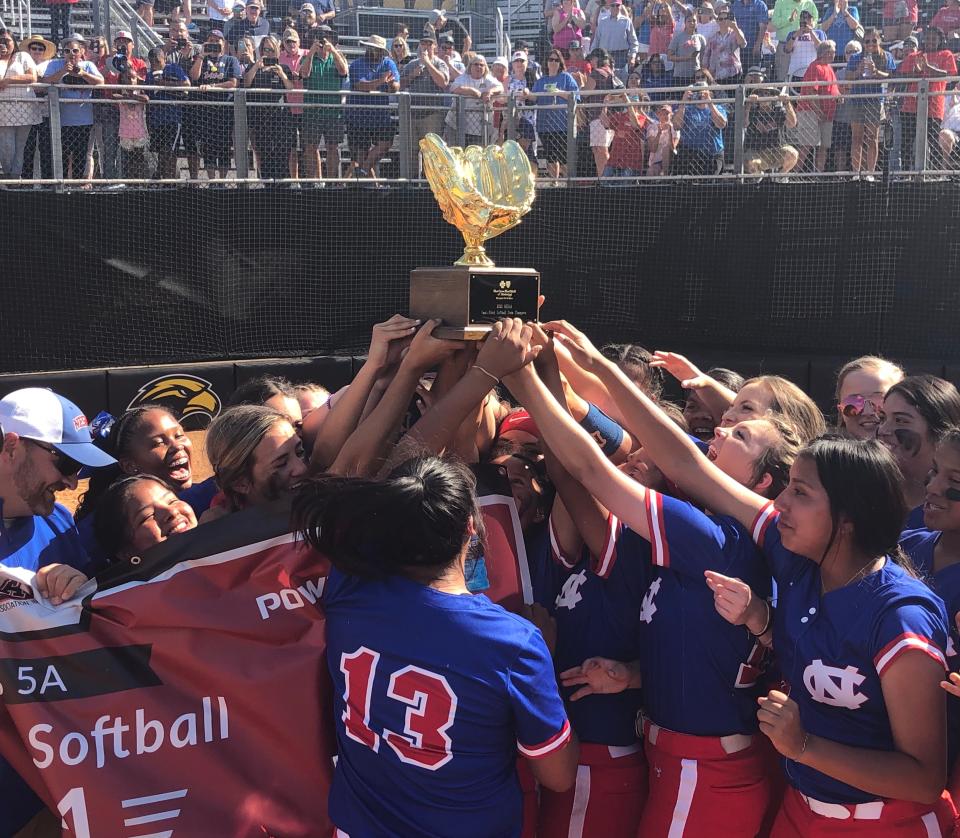 The Neshoba Central softball team hoists the MHSAA 5A championship trophy on May 14, 2021 at Southern Miss.