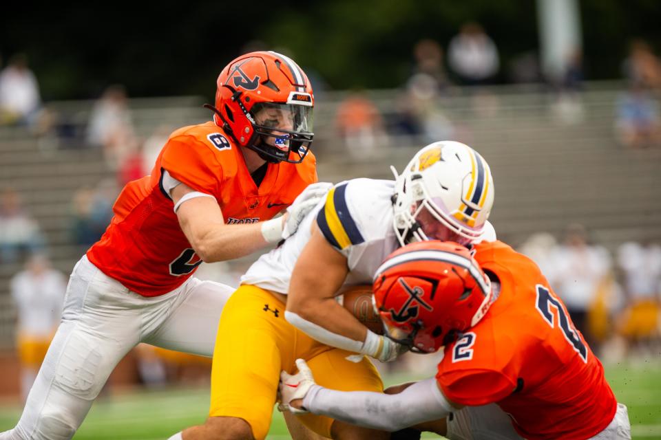 Hope's Brad Raredon (8) and Nick Flegler (2) make a stop on the MSJ rusher Saturday, Sept. 16, 2023, at Hope's Ray and Sue Smith Stadium.