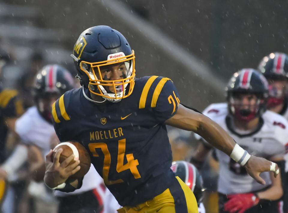 Jordan Marshall of Moeller runs the ball for a touchdown against East Central at Shea Stadium on Saturday, Sept. 3, 2022.