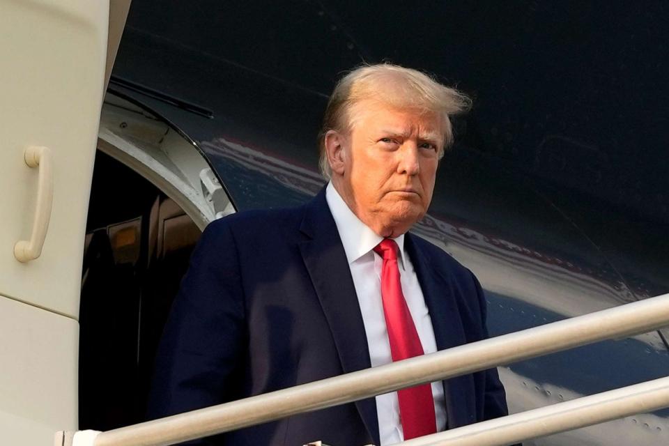 PHOTO: Former President Donald Trump steps off his plane as he arrives at Hartsfield-Jackson Atlanta International Airport, Aug. 24, 2023, in Atlanta. (Alex Brandon/AP)