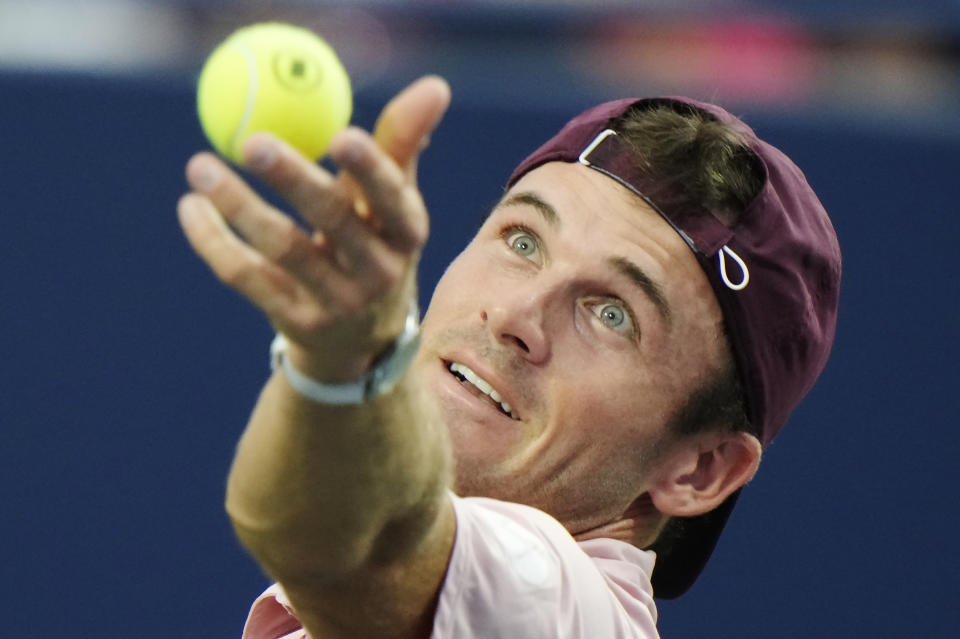 Tommy Paul, of the United States, serves to Jannik Sinner, of Italy, during men's tennis match action at the National Bank Open in Toronto, Saturday, Aug. 12, 2023. (Frank Gunn/The Canadian Press via AP)