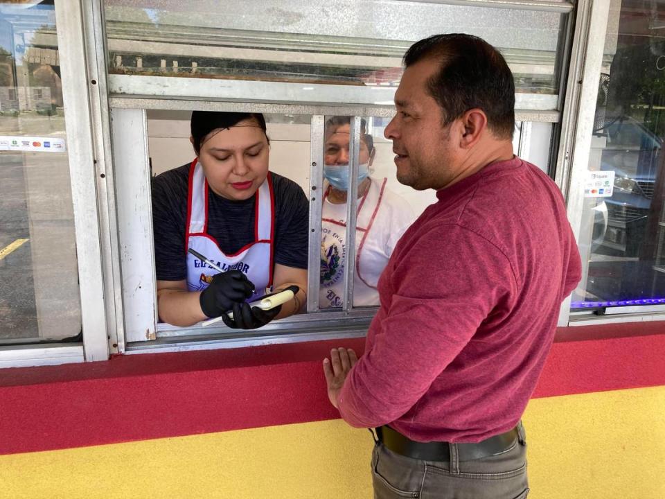 Elder Zuniga places an order at Delicias Salvadorenas, a new take-out restaurant offering authentic Salvadoran tacos, pupusas and tortas.