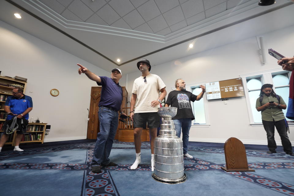 NHL player Nazem Kadri stands with the Stanley Cup at the London Muslim Mosque in London, Ontario on Saturday Aug. 27, 2022. Kadri, 31, won the cup for the first time while playing with the Colorado Avalanche. (Geoff Robins /The Canadian Press via AP)