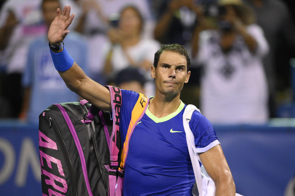 Rafael Nadal, of Spain, waves to the fans as he leaves the court after he lost to Lloyd Harris, of South Africa, at the Citi Open tennis tournament Thursday, Aug. 5, 2021, in Washington. Harris won 6-4, 1-6, 6-4. (AP Photo/Nick Wass)