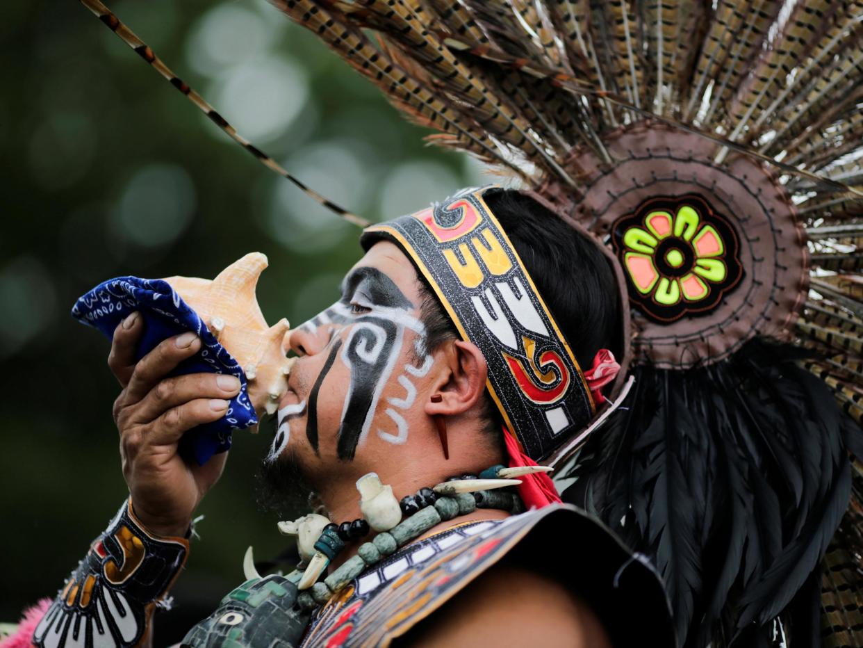 A reveler performs during a "pow-wow" celebrating the Indigenous Peoples' Day Festival in Randalls Island in New York on 8 October 2017: Eduardo Munoz/Reuters