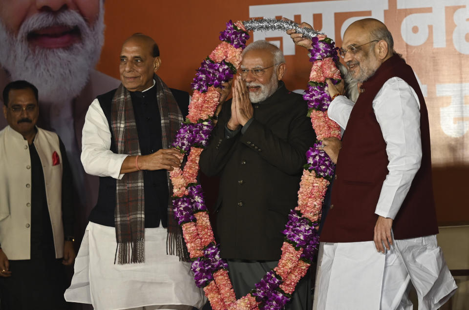 Indian Prime Minister Narendra Modi is garlanded by Defense Minister Rajnath Singh, left, Bharatiya Janata Party (BJP) President Jagat Prakash Nadda, behind, unseen and Home Minister Amit Shah, right during celebrations following BJP's victory in the state elections at the BJP headquarters in New Delhi, India, Sunday, Dec. 3, 2023. India's Hindu nationalist party was headed for a clear win in three out of four states Sunday, according to the election commission's website. (AP Photo)
