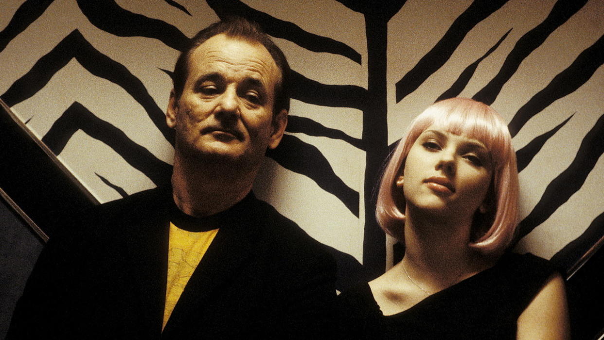  Bob and Charlotte sit next to each other on a bench in Lost in Translation. 