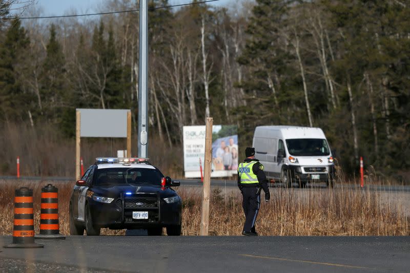 Motorists are stopped at a police checkpoint at the Manitoba-Ontario boundary