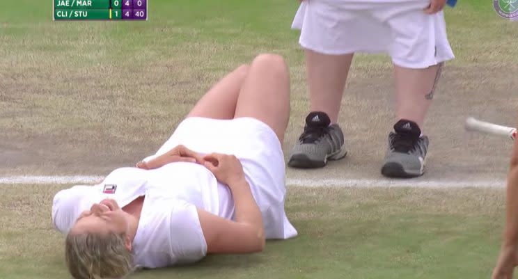 Kim Clijsters couldn't contain her laughter after the male fan put on one of her skirts at Wimbledon.