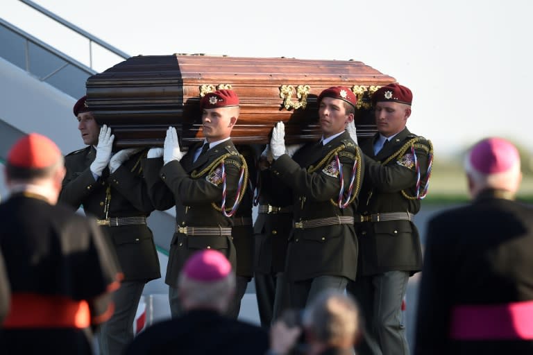 Bells rang across the Czech capital Prague marking the arrival of the remains of a Catholic cardinal, persecuted by both the Nazis and the Communists, for reburial at home after he died in exile at the Vatican decades ago