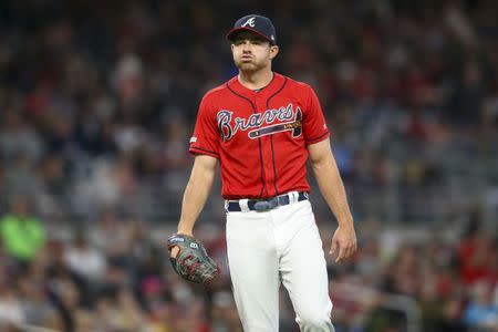 Apr 26, 2019; Atlanta, GA, USA; Atlanta Braves relief pitcher Jesse Biddle (19) reacts after a play against the Colorado Rockies in the eighth inning at SunTrust Park. Mandatory Credit: Brett Davis-USA TODAY Sports