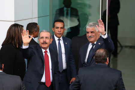 President of the Dominican Republic Danilo Medina and Chancellor of the Dominican Republic Miguel Vargas wave as they arrive to attend Venezuela's government and opposition coalition meeting in Santo Domingo, Dominican Republic February 7, 2018. REUTERS/Ricardo Rojas