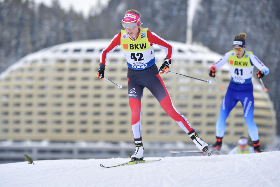 FILE - Teresa Stadlober, right, of Austria competes during the women's 10 km free style race at the Davos Nordic FIS Cross Country World Cup in Davos, Switzerland, on Dec. 16, 2018. The 2022 Olympics is just weeks away with China a more problematic host than expected for a Winter Games that had once seemed destined for Europe. The past weekend of World Cup ski events in two upscale Swiss towns that wanted to stage these Olympics showed what might have been. Games in snow-covered resorts with decades of winter sports tradition and without diplomatic boycotts or talk of human rights records. (Juergen Staiger/Keystone via AP, file)