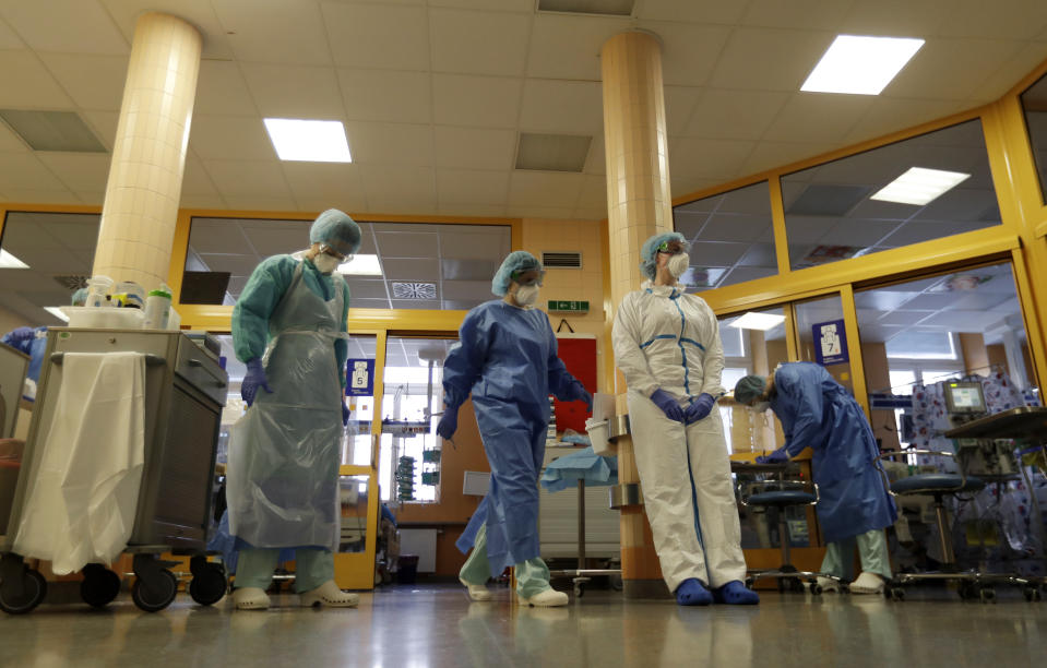 Healthcare workers during their shift in an intensive care unit (ICU) at the General University Hospital where patients infected with the COVID-19 are treated in Prague, Czech Republic, Tuesday, April 7, 2020. The new coronavirus causes mild or moderate symptoms for most people, but for some, especially older adults and people with existing health problems, it can cause more severe illness or death. (AP Photo/Petr David Josek)