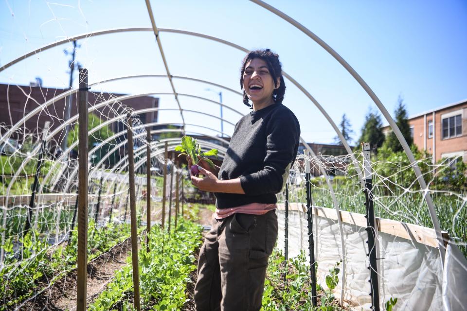 Chloe Moore, farm director, tends to the Southside Community Farm in the historically Black Asheville neighborhood of Southside on April 27, 2022.