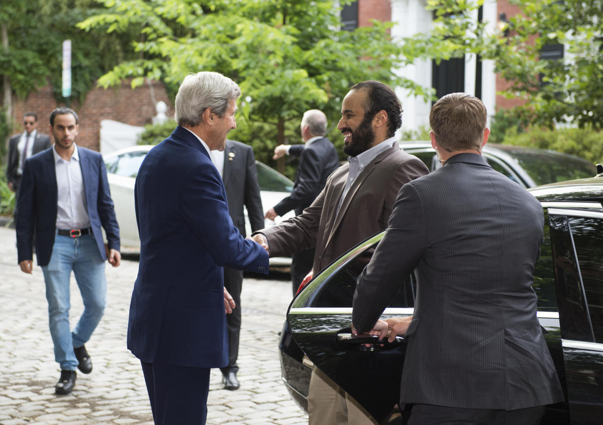 John Kerry, then U.S. secretary of state, left, greets Saudi Deputy Crown Prince Mohammed bin Salman outside Kerry's Washington, D.C., residence, before a meeting with him in June 2016.