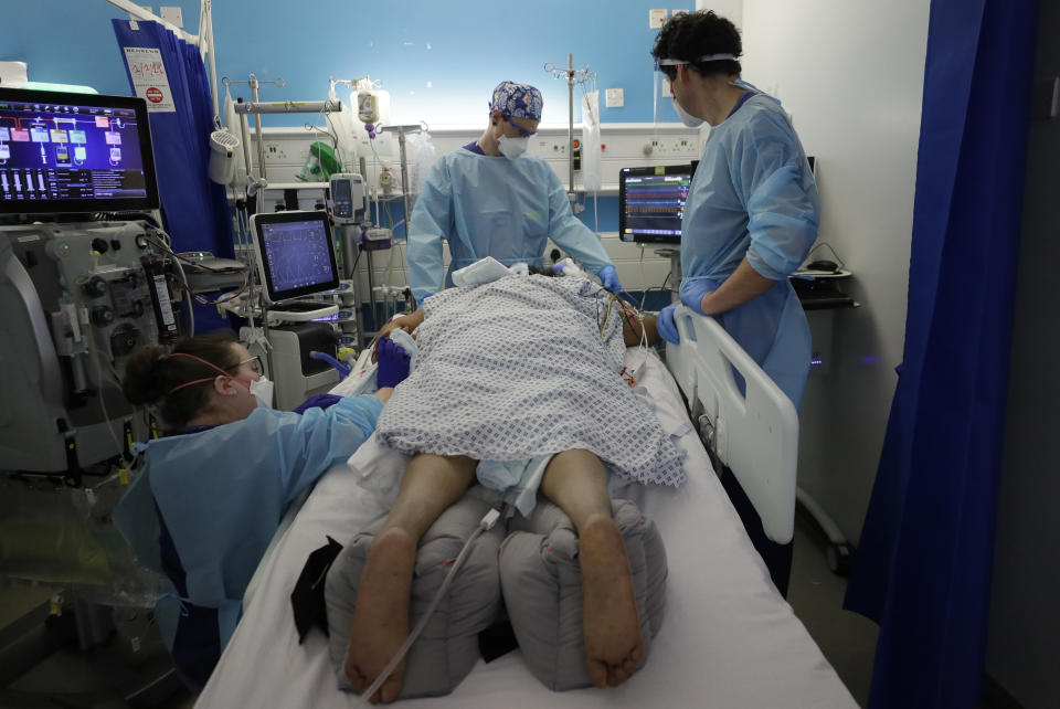 Critical Care staff look after a COVID-19 patient on the Christine Brown ward at King's College Hospital in London, Wednesday, Jan. 27, 2021. (AP Photo/Kirsty Wigglesworth, Pool)