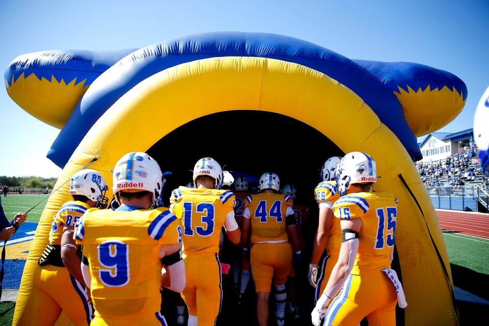 Piedmont prepares to run onto the field during the high school football game between Piedmont and Carl Albert at Piedmont High School in Piedmont, Oka., Saturday, Oct. 17, 2020. Photo by Sarah Phipps, The Oklahoman