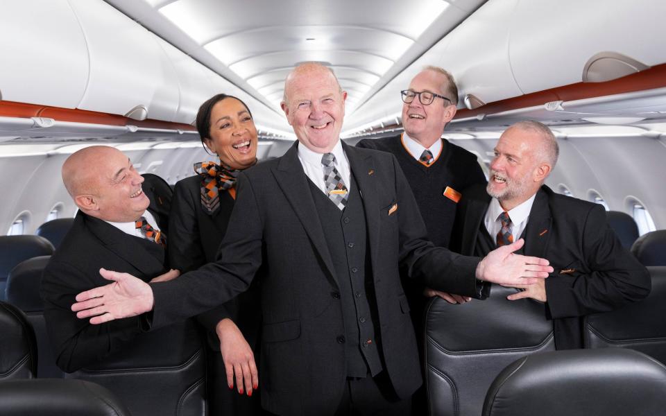 Mike Tear, aged 57, Eva Lewis, aged 48, Peter Wanless, aged 68, Neil Brown, aged 59 and Gary Fellowes, aged 63 feature in a new recruitment campaign from easyJet aimed at older workers - Matt Alexander/PA