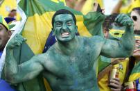 REFILE - ADDING DROPPED WORD A Brazil fan poses before the 2014 World Cup quarter-finals between Brazil and Colombia at the Castelao arena in Fortaleza July 4, 2014. REUTERS/Stefano Rellandini