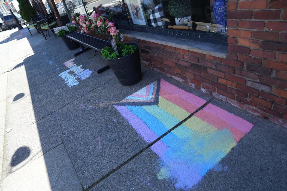 Rainbow Pride symbols on display in downtown Boonton. The signs have proliferated since a town council vote that critics saw as targeting the Pride flag.