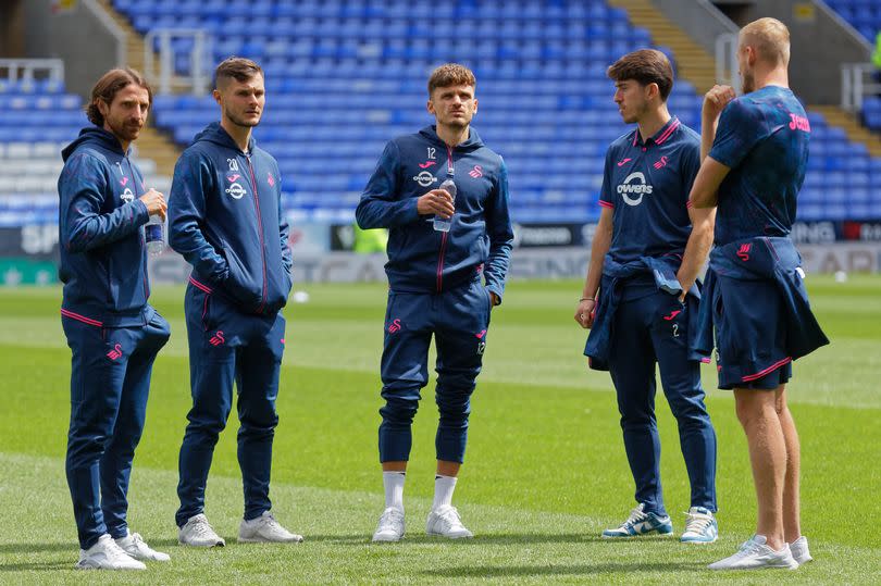 Joe Allen (left) has agreed new terms with the club, while they have exercised the option on Liam Cullen (second left) and Jamie Paterson (middle) has been offered a new contract -Credit:Athena Pictures/Getty Images