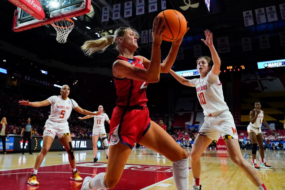 Arizona forward Cate Reese, center, tries to pass the ball while Maryland's Abby Meyers (10), guard Brinae Alexander (5), guard Faith Masonius (13) and guard Diamond Miller (1) defend during the first half of a second-round college basketball game in the NCAA Tournament, Sunday, March 19, 2023, in College Park, Md. (AP Photo/Julio Cortez)