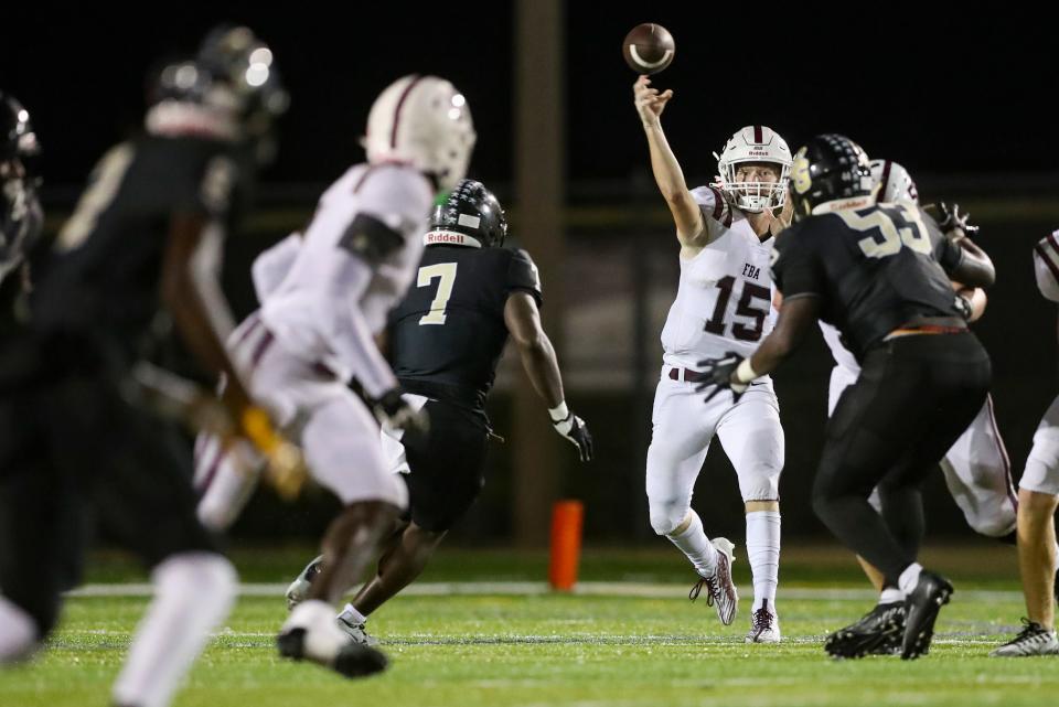 First Baptist Academy Lions quarterback Ethan Crossan (15) passes the ball during the third quarter of a game against the Golden Gate Titans at Golden Gate High School in Naples on Friday, Sept. 29, 2023.