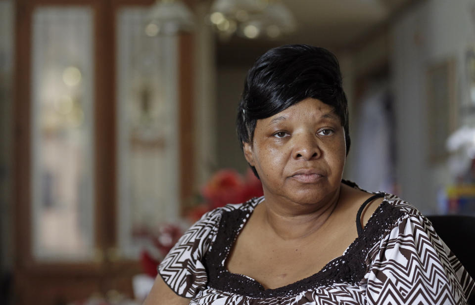 In this photo taken Tuesday, Aug. 6, 2019 Brenda Scurlock is shown at her home in Lumber Bridge, N.C. Scurlock's son Avery Scurlock, who used the name Chanel when dressing as a woman in social settings and hoped to have sex reassignment surgery, was found shot to death in June. This death of a transgender person in North Carolina is one of 18 so far this year, and 17 of the victims have been black women. (AP Photo/Gerry Broome)