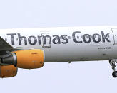 FILE - In this May 19, 2016 file photo, a Thomas Cook plane takes off in England. Veteran British tour operator Thomas Cook collapsed after failing to secure rescue funding, and travel bookings for its more than 600,000 global vacationers were canceled early Monday, Sept. 23, 2019. (Tim Goode/PA via AP, file)