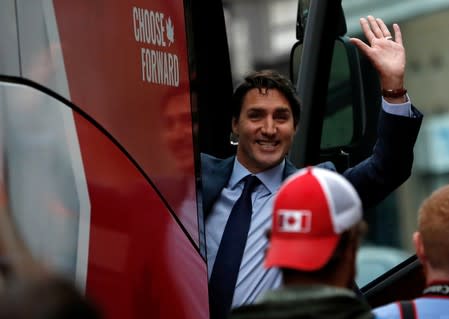 Liberal leader and Canadian Prime Minister Justin Trudeau waves after an interview at TVA studio as he campaigns for the upcoming election, in Montreal