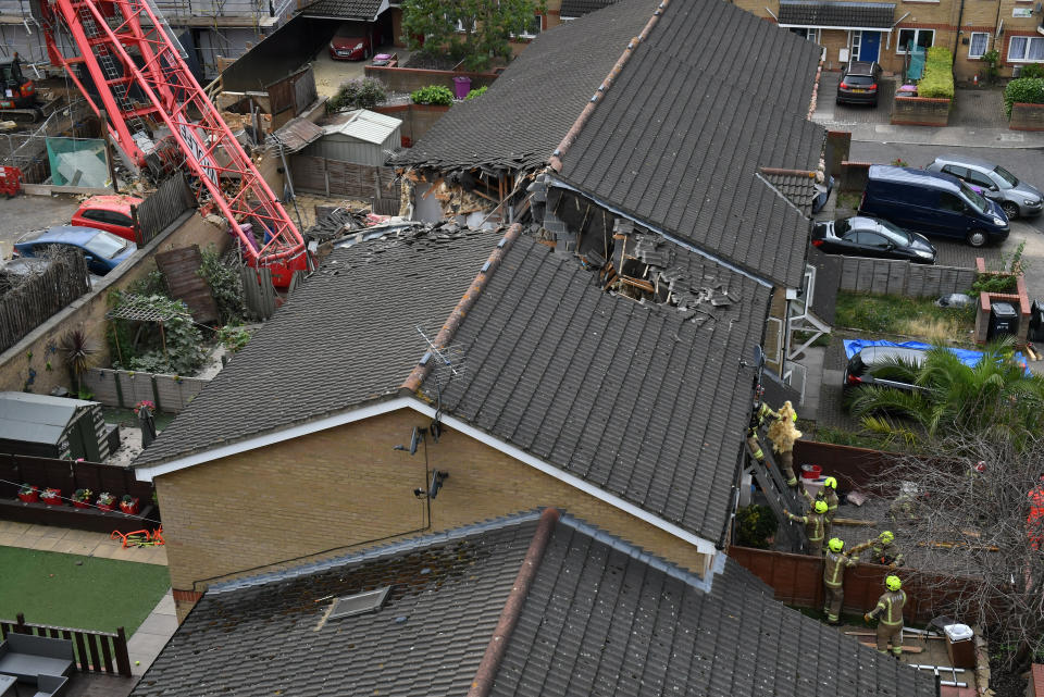 The scene in Bow, east London, where a 20-metre crane has collapsed on to a house leaving people trapped inside.