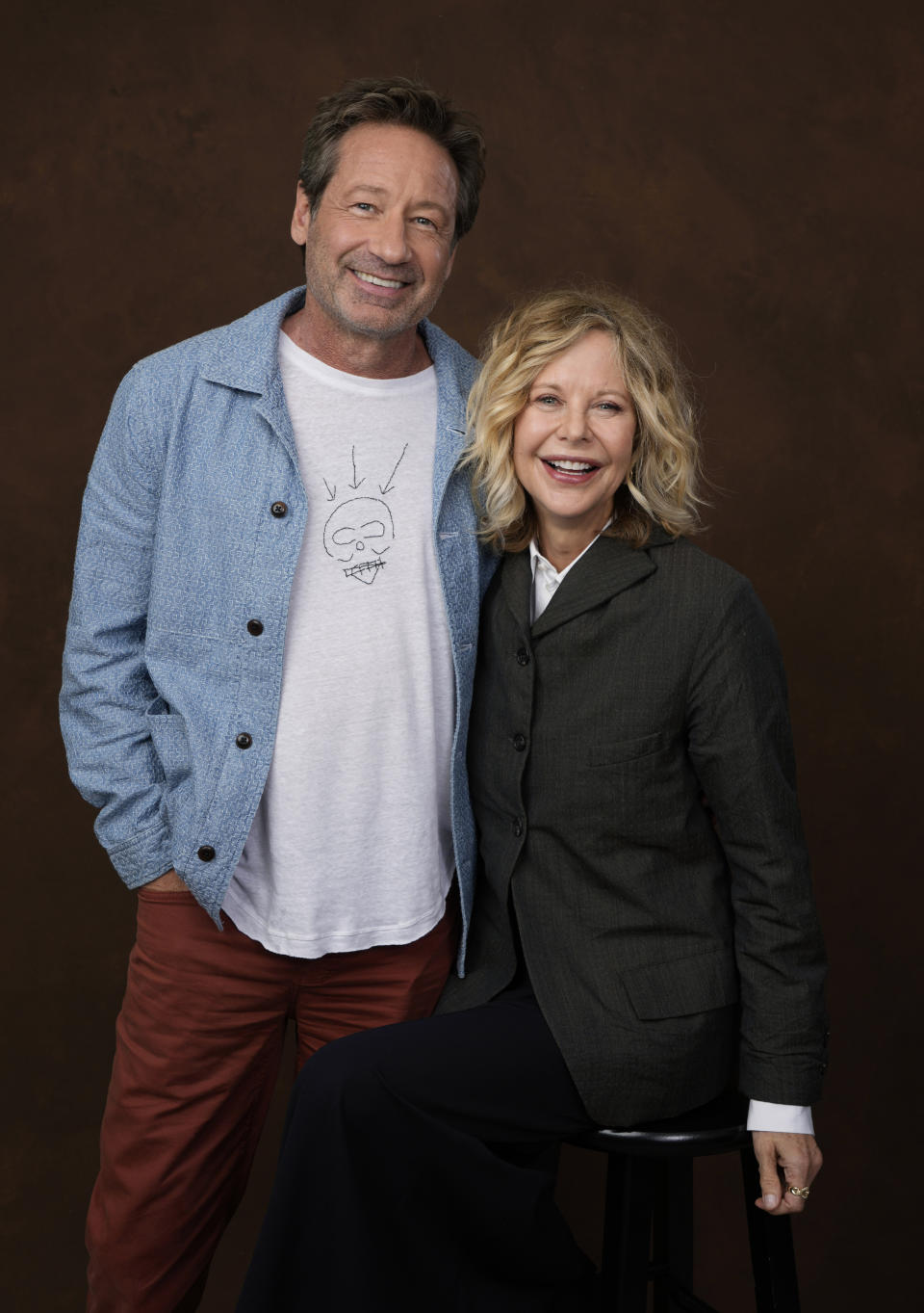 Actor-director Meg Ryan, right, poses with co-star David Duchovny at the Four Seasons Hotel in Los Angeles on Wednesday, Oct. 25, 2023, to promote their film "What Happens Later." (AP Photo/Chris Pizzello)