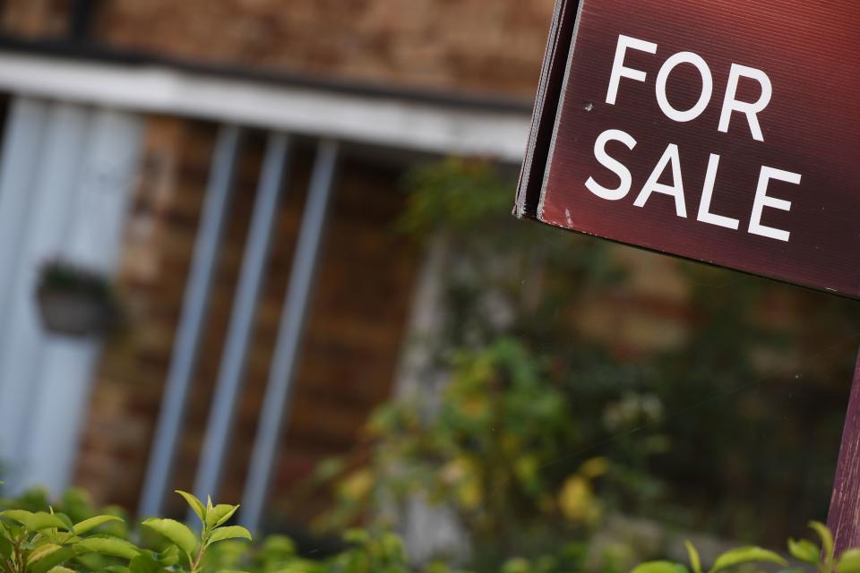 An estate agent’s ‘for sale’ board stands outside a residential building in London. Photo: Chris J Ratcliffe/AFP/Getty Images