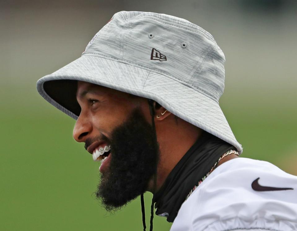Cleveland Browns wide receiver Odell Beckham Jr. laughs on the sideline during NFL football training camp, Thursday, July 29, 2021, in Berea, Ohio.